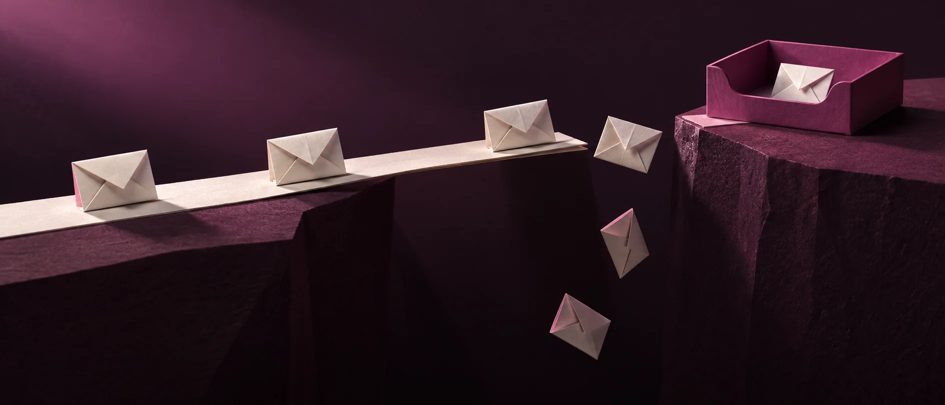 Envelopes fall through a gap just before an inbox, illustrating enquiries lost at the final step.